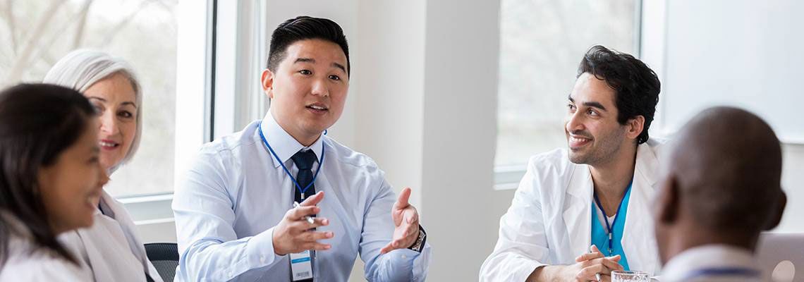 Medical professionals having a discussion at a table